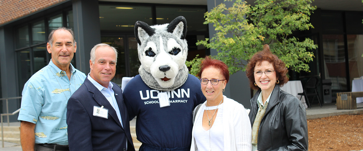 UConn School of Pharmacy Alums at reunion with Jonathan the UConn mascot